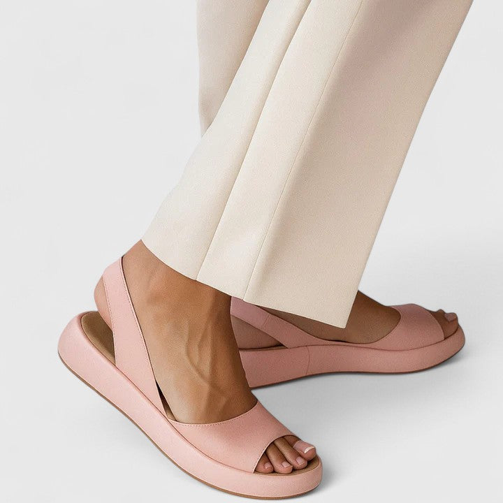 Women's orthopedic sandals in blush pink with cushioned insole and slip-on back strap design for all-day comfort