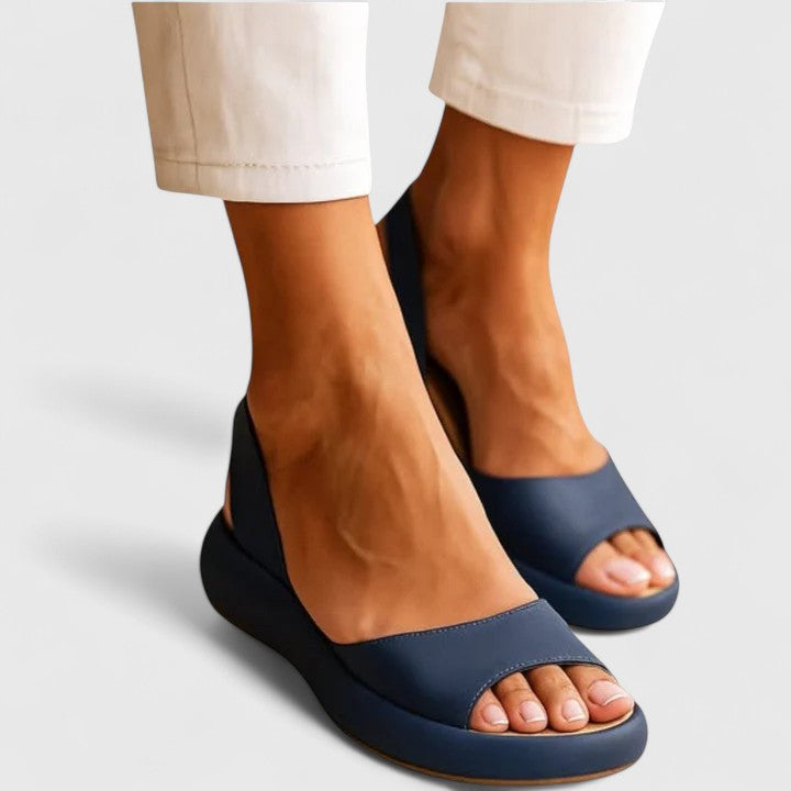 Close-up of orthopedic sandal upper displaying smooth finish and structured design with adjustable back strap