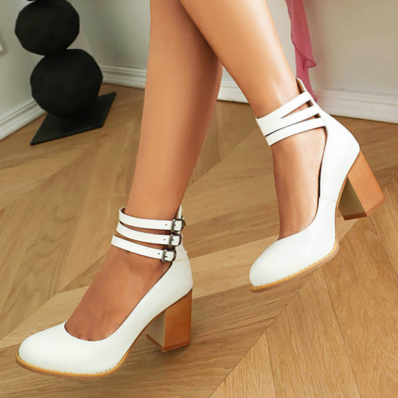 Side angle of block heel sandals with secure ankle strap and smooth leather-look finish