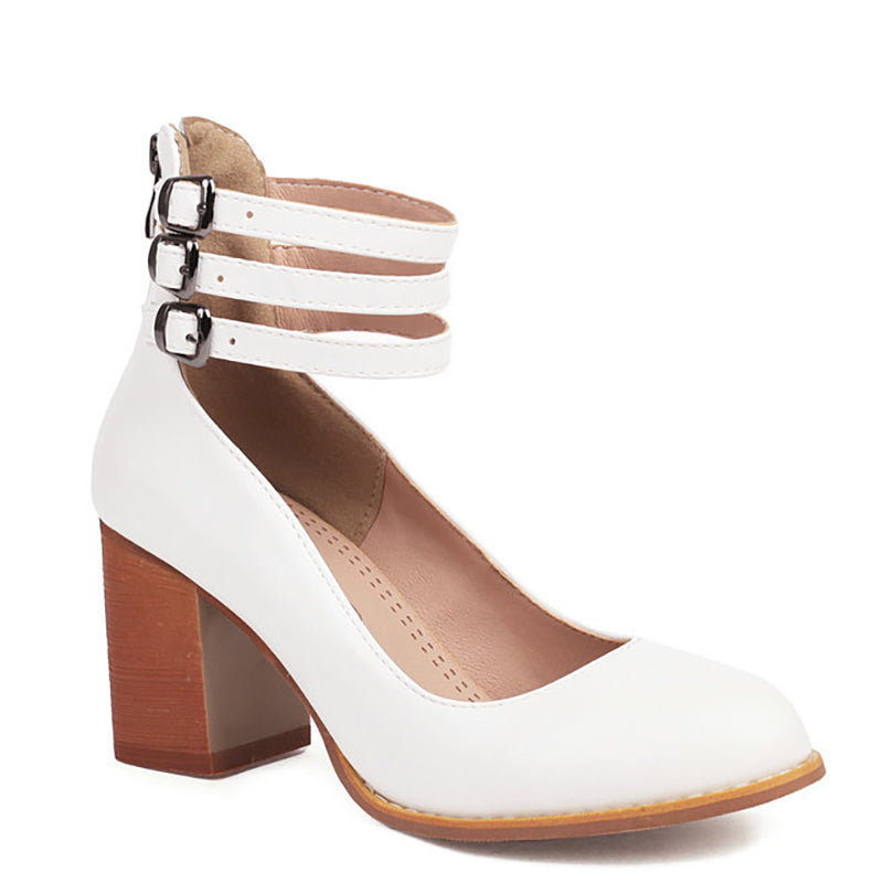 Detail of thick block heel and ankle strap design on minimalist smooth sandals