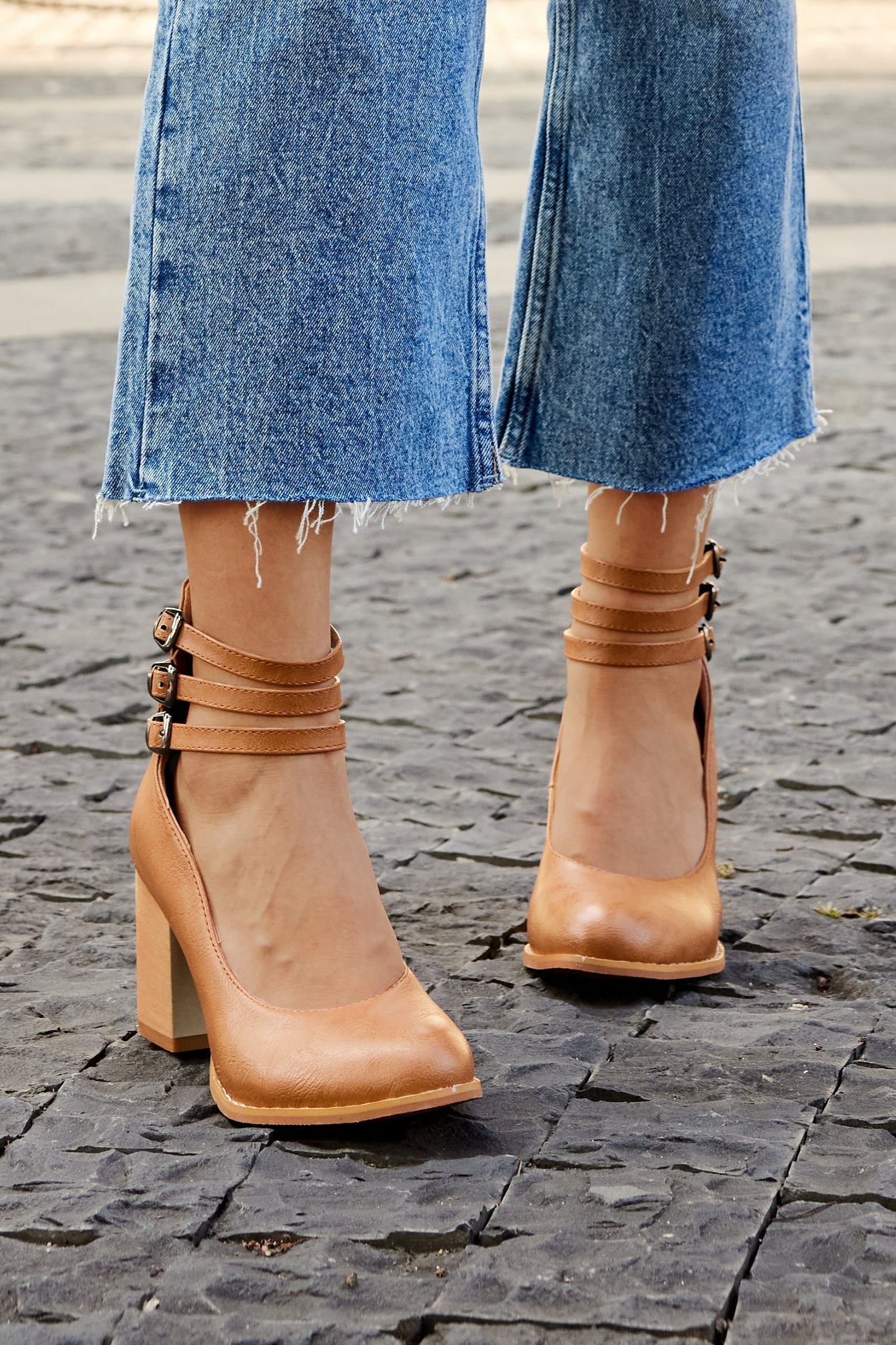 Front view of minimalist sandals with ankle strap and stable block heel design