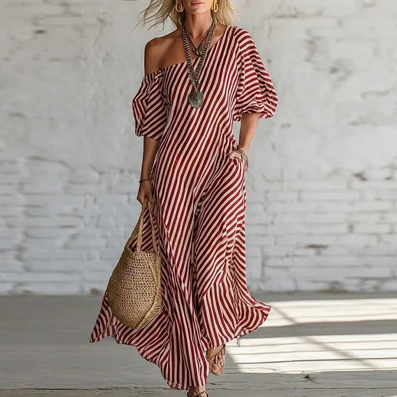 Full length view of striped maxi dress with one shoulder design and relaxed A-line fit