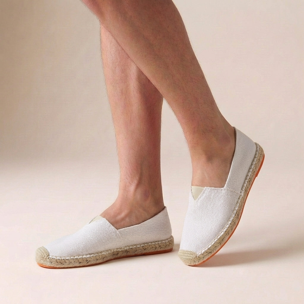 Side view of Women's Orthopedic Jute Sole Slip-On Espadrilles in beige canvas with natural jute sole and flat rubber base