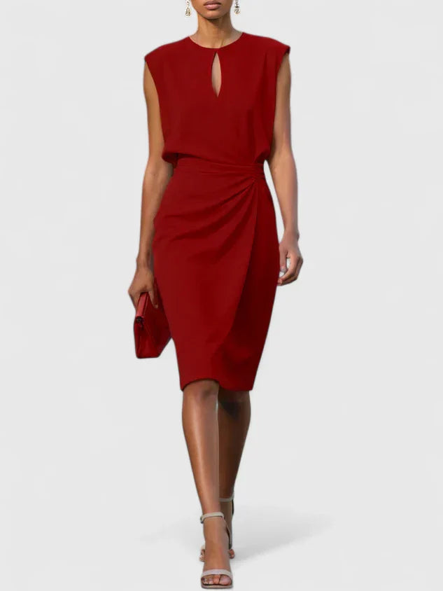 Evening sophisticated dress in navy featuring keyhole neckline and flattering draped waist