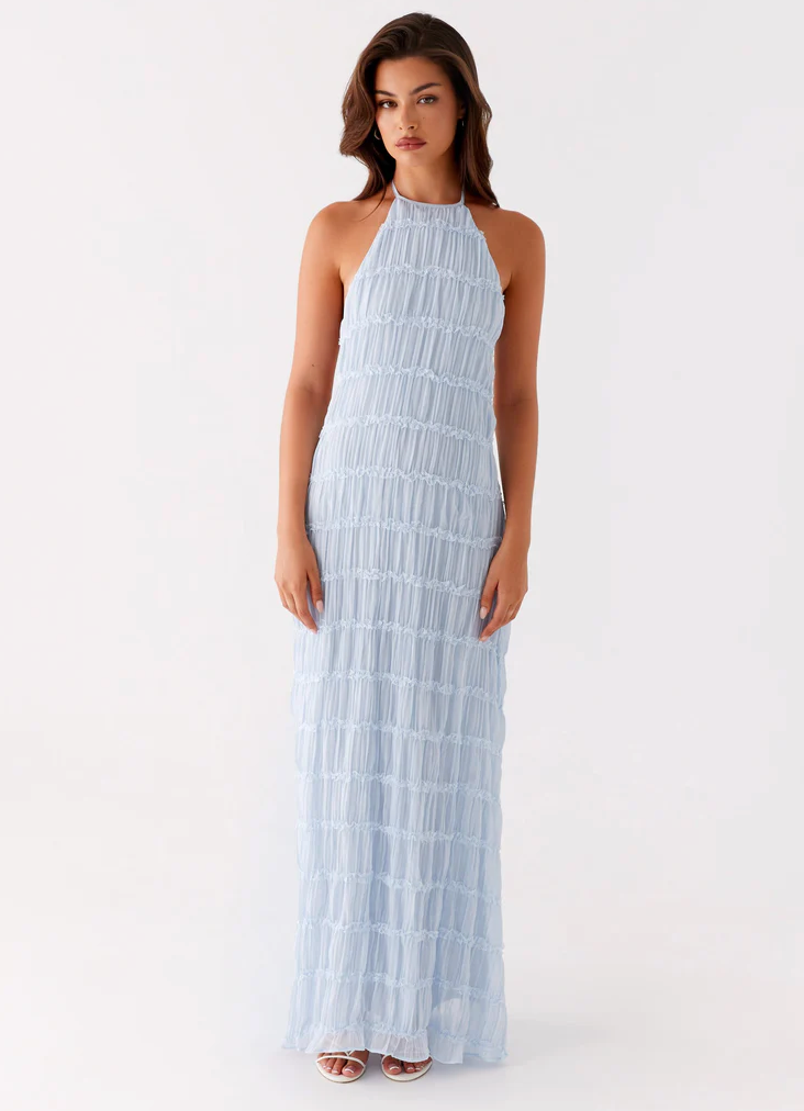 Close-up of adjustable halter neckline and textured tiered bodice on maxi dress