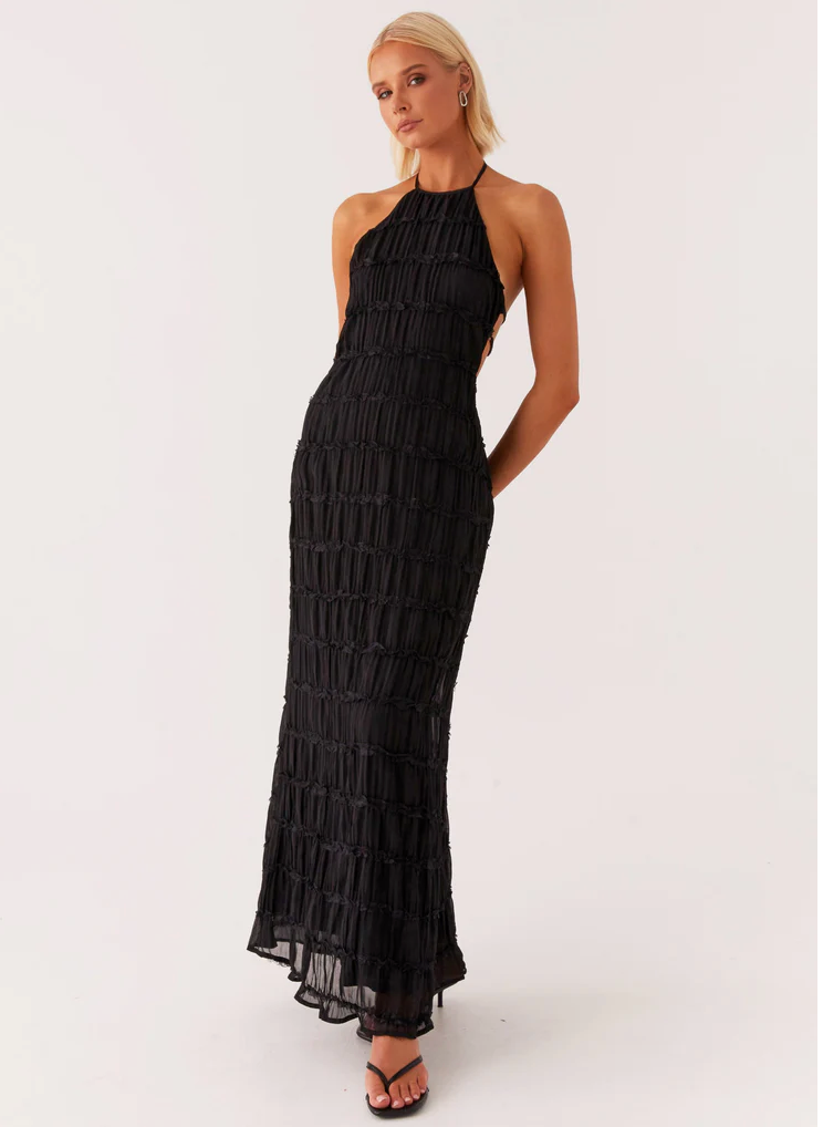 Full-length halter maxi dress styled for formal occasions and wedding events