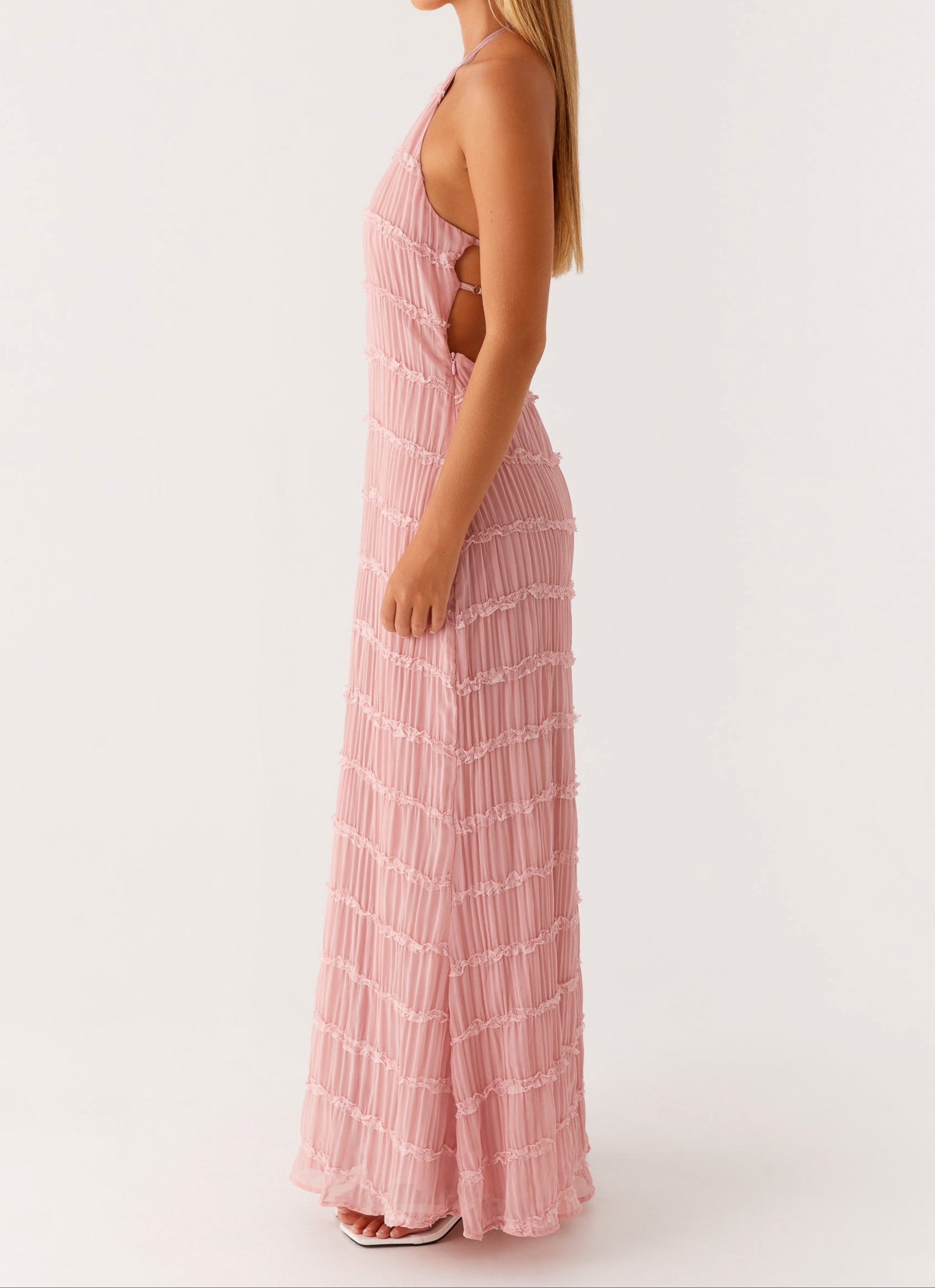 Blue halter maxi dress with tiered detailing and floor-length hem