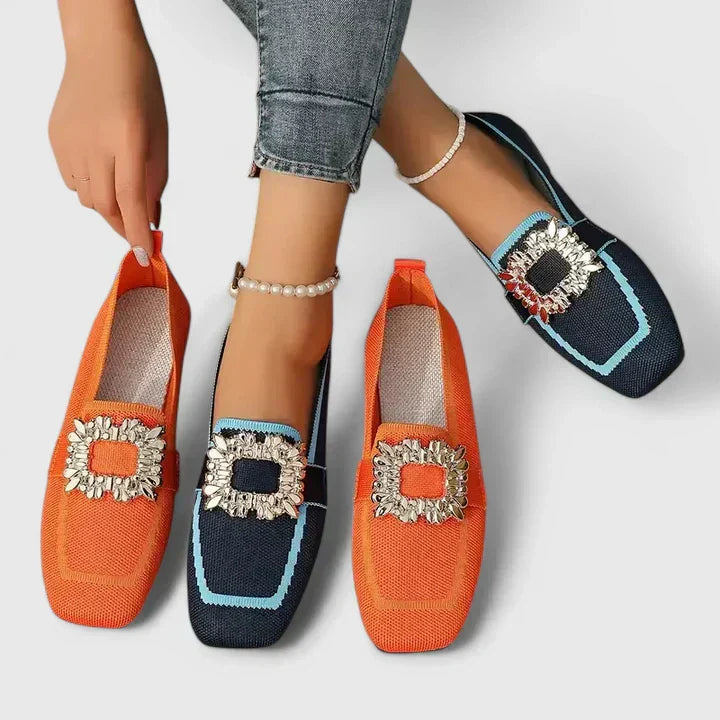 Close-up of orthopedic loafer showing structured textile upper and decorative buckle detail on foot