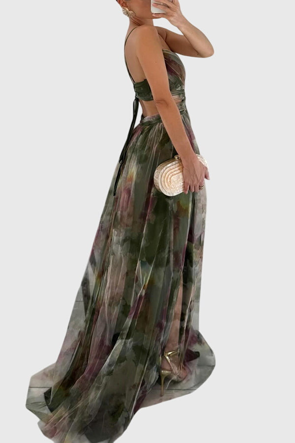 Back view of floral maxi dress showing crisscross adjustable straps and flowing silhouette