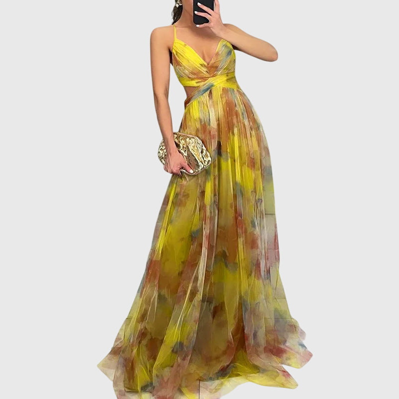 Woman twirling in floral maxi dress showing fabric movement and drape