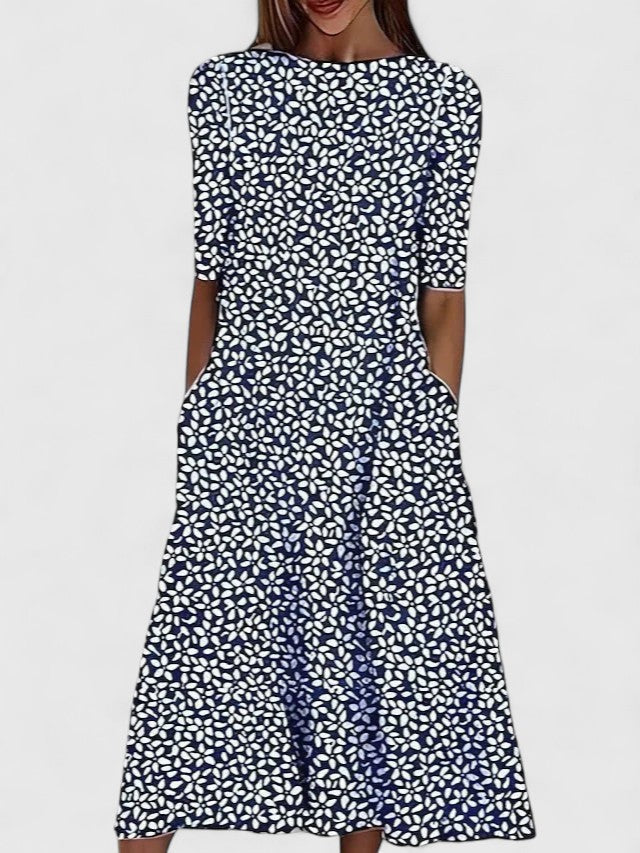 Side angle of a floral midi dress showing A-line silhouette and concealed side pockets