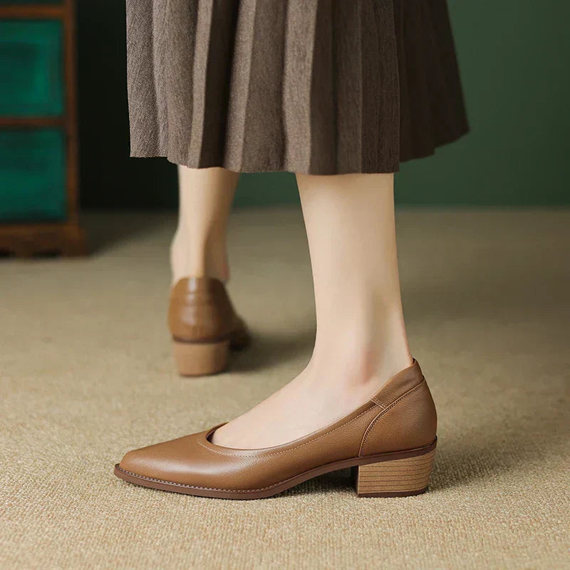 Women's mid heel pumps in neutral tone with pointed toe and block heel construction