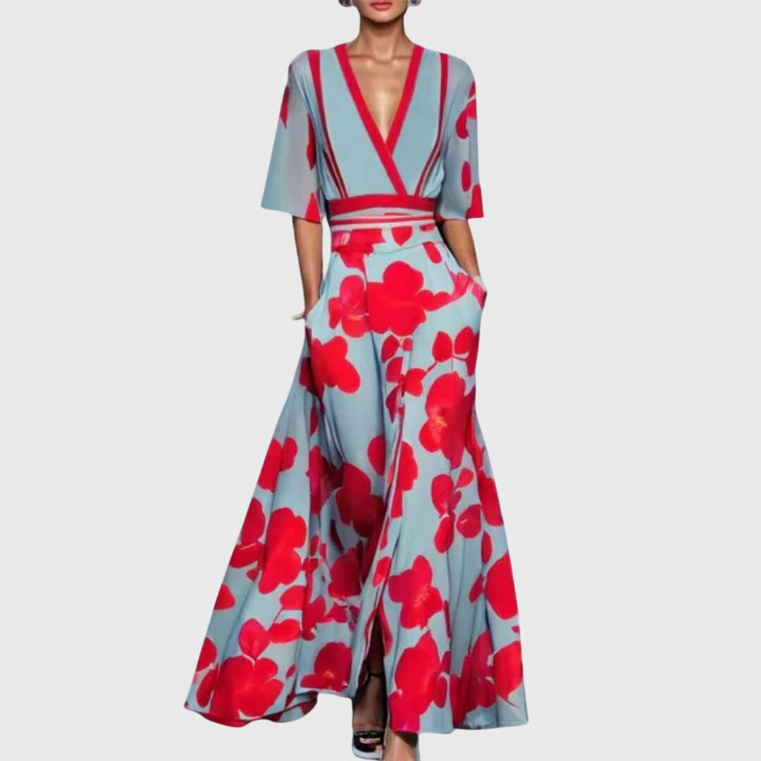 Full-length floral maxi dress with wrap bodice, floor-length flared skirt, and blue-grey botanical print on white background