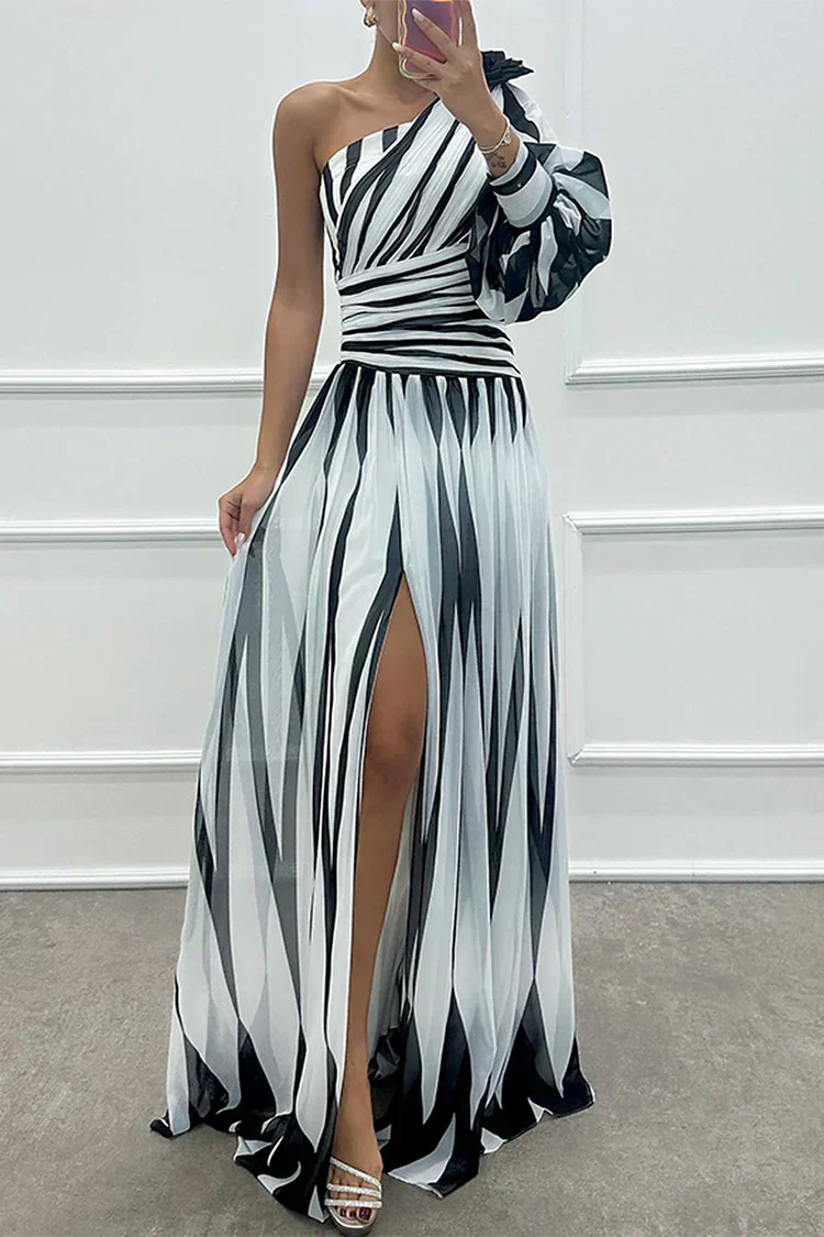 One shoulder striped maxi dress with dramatic puff sleeve and flowing pleated skirt for formal events