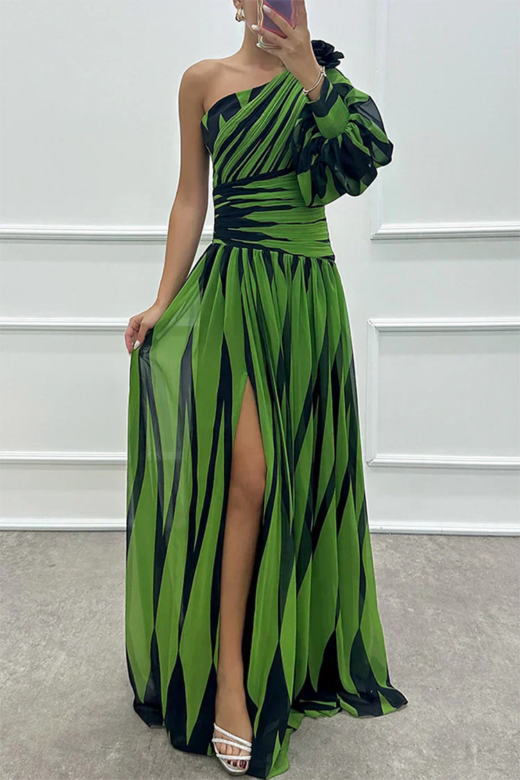 Close-up view of one shoulder maxi dress showing bold black and white striped pattern detail