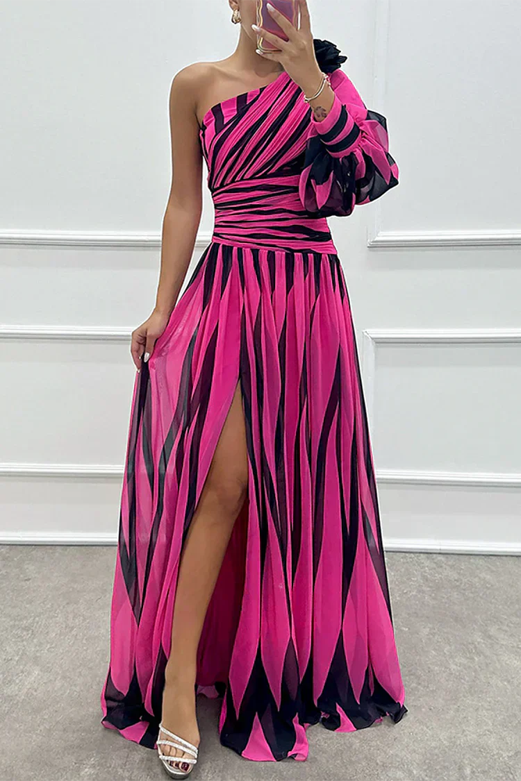 Side angle of striped maxi dress highlighting fitted waist and front slit design feature
