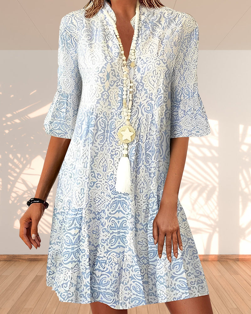 Women's Boho Patterned V Neck Flare Sleeve Mini Dress with blue paisley print and tassel trim detail