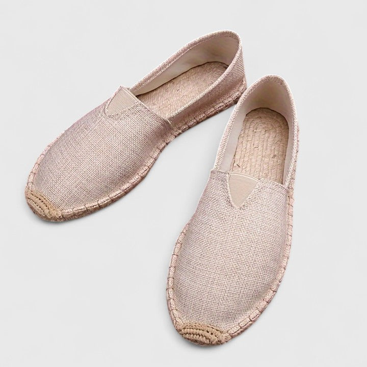 Side view of women's slip-on espadrilles showing elastic side panel and contoured footbed