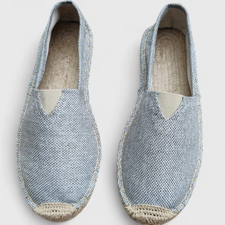 Detail of elastic side gusset and slip-on design on canvas espadrilles