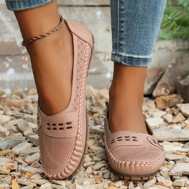 Women's orthopedic slip on loafers in light pink paired with casual denim, ideal for everyday errands