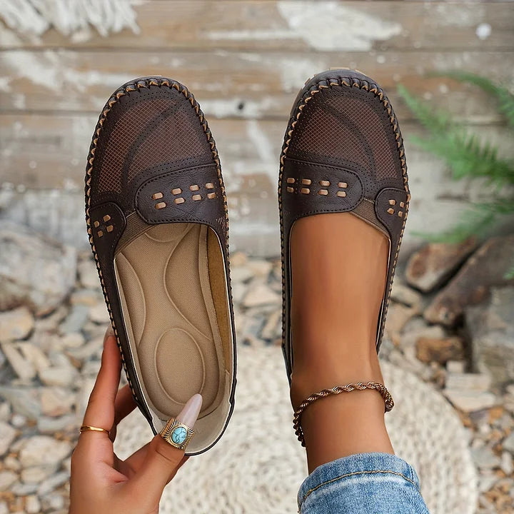 Side view of women's orthopedic slip on loafers displaying cushioned insole and textured flexible sole