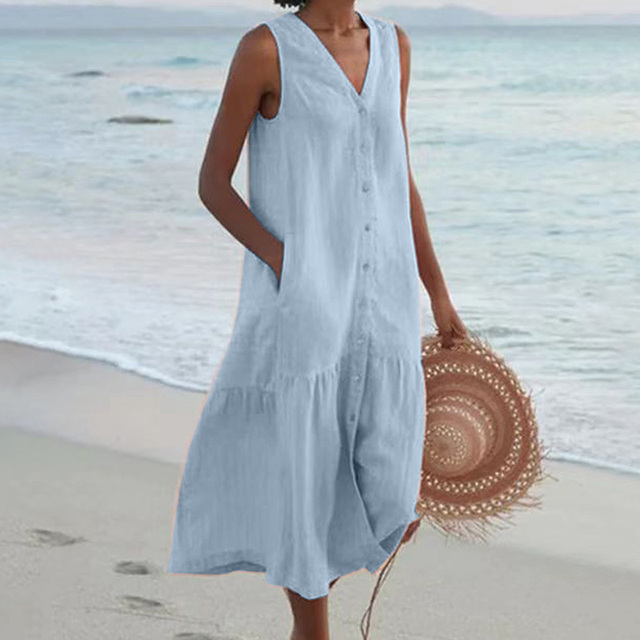 Close-up view of V-neckline and button-front detail on sleeveless linen beach dress