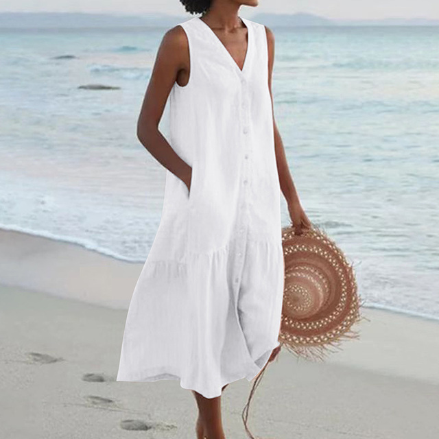 Side view showing relaxed A-line silhouette and tiered midi hem of linen beach dress