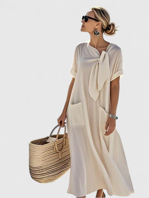 Side view of flowing maxi elegant summer dress showing relaxed silhouette and short sleeves