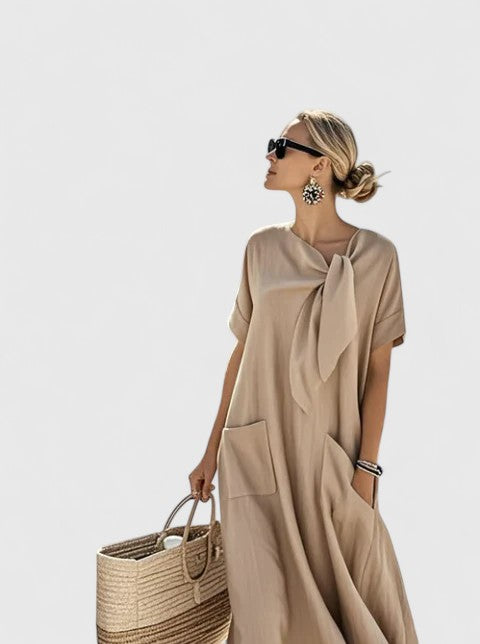 Full-length view of elegant summer dress with patch pockets and A-line cut