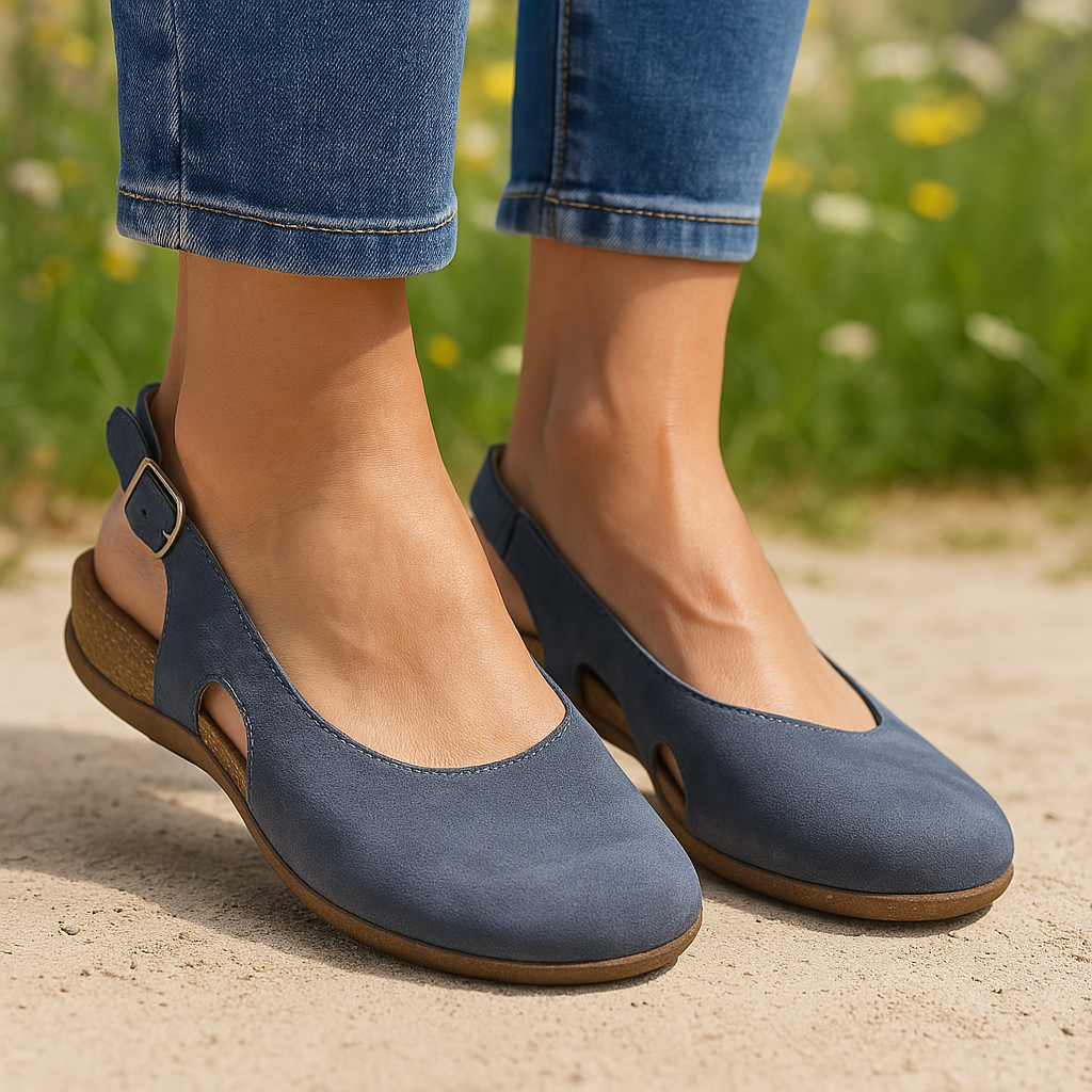 Woman wearing women's slingback orthopedic sandals in navy with adjustable buckle strap and contoured footbed on outdoor patio