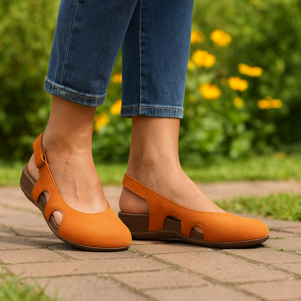 Side angle of women's slingback orthopedic sandals displaying adjustable heel strap and shaped footbed for arch support
