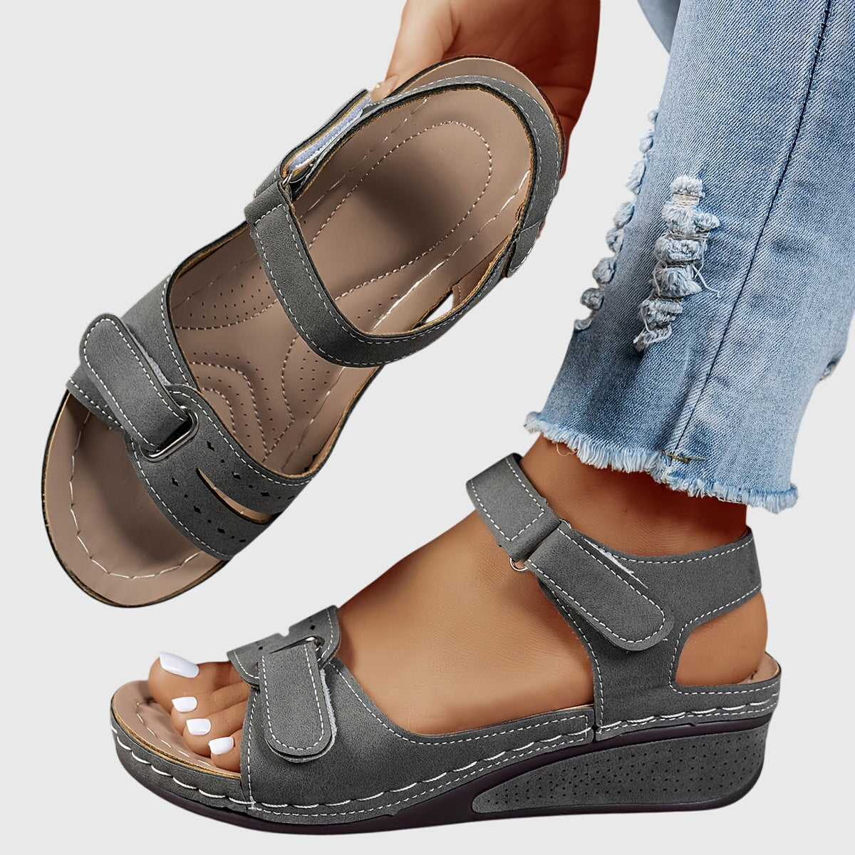 Women's orthopedic sandals on foot showing secure ankle strap and contoured arch support
