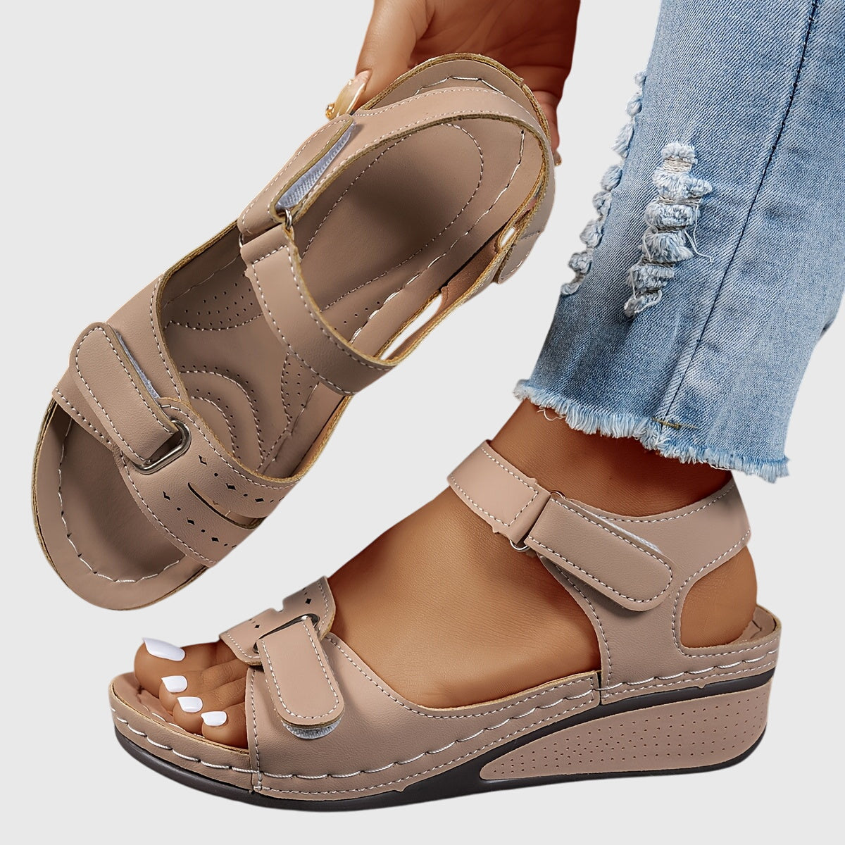 Detail of orthopedic sandal footbed with perforated ventilation and cushioned insole design