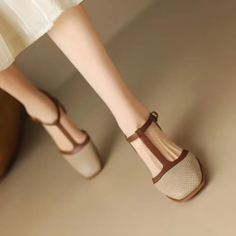 Detail shot of Women's T-Strap Block Heel Shoes buckle fastening and contrast strap against perforated upper