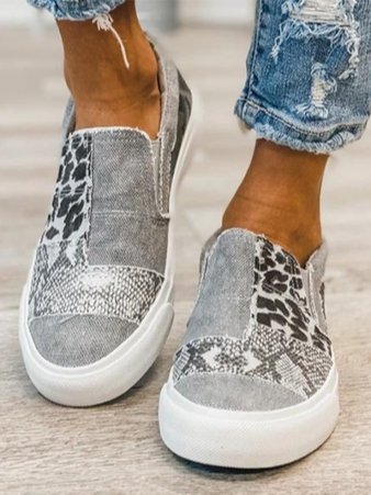 Women's casual loafers with snakeskin and leopard print canvas, cushioned insole, and durable rubber sole for everyday wear
