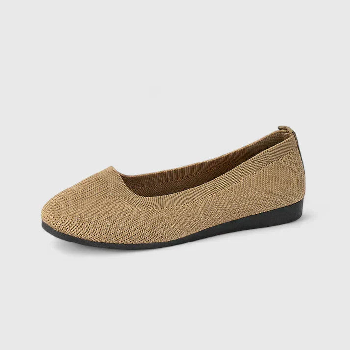 Rear view of beige knit orthopedic slip on shoe with structured heel counter and black outsole