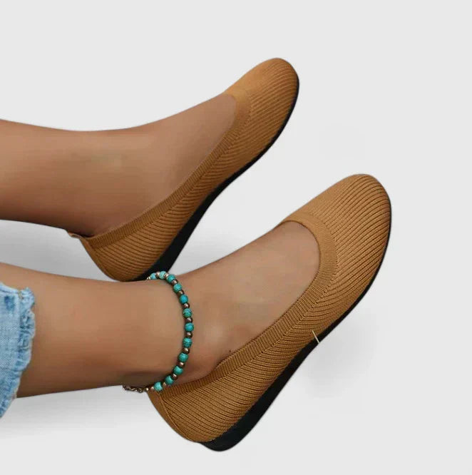 Top view of women's orthopedic shoes slip on showing rounded toe box and flexible knit construction