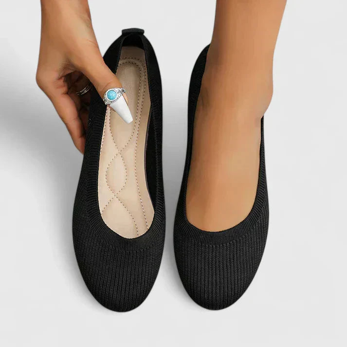 Detail of textured knit upper on women's orthopedic slip on shoe with supportive footbed