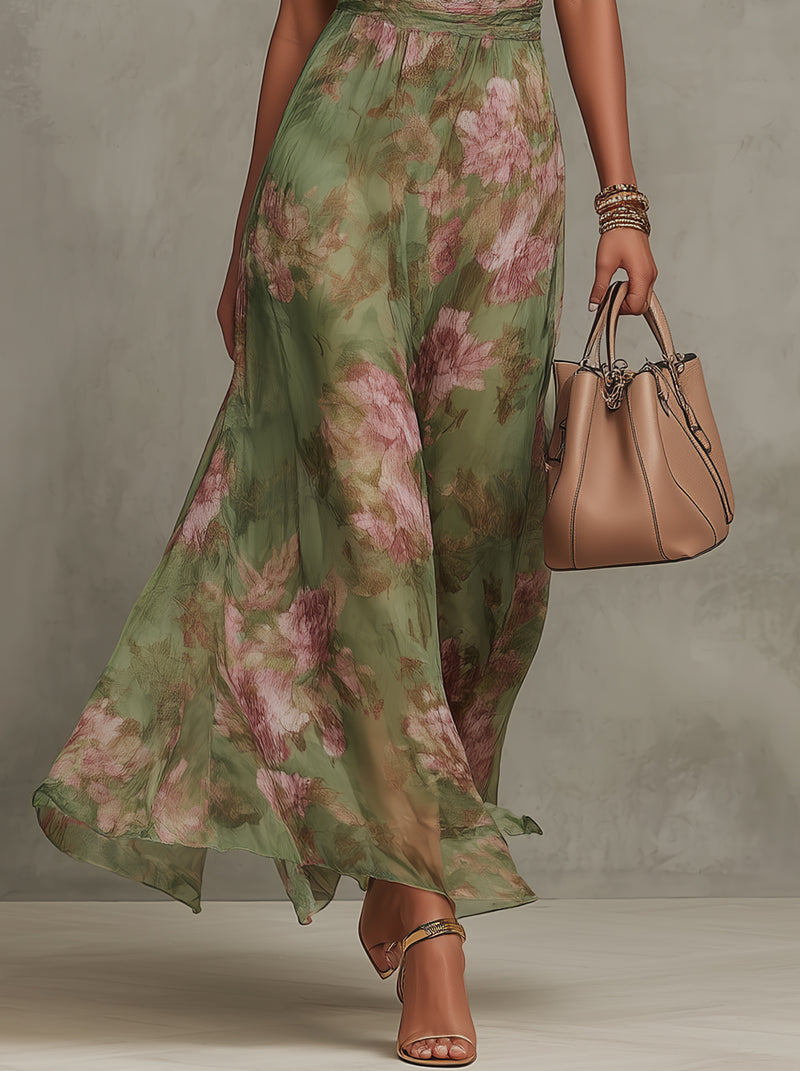Floor-length halter dress in green floral chiffon with belted waist and romantic silhouette