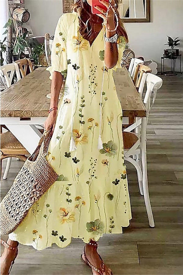 Side view of boho floral maxi dress showing relaxed short sleeves and ankle-grazing length