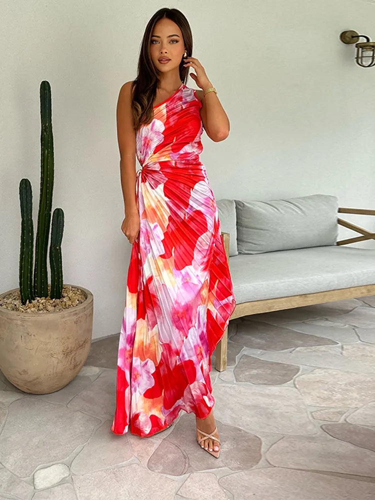 Full length pleated summer dress with flowing silhouette and structured fabric