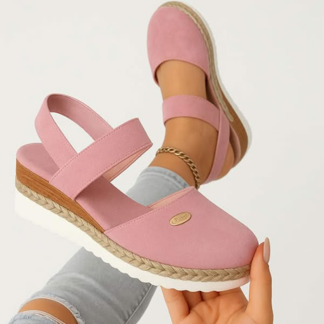 Side view of women's orthopedic sandals showing wide heel base and elastic ankle strap with adjustable closure