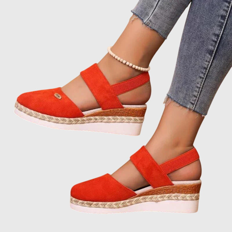 Detail of adjustable hook-and-loop ankle strap on women's orthopedic sandals with supportive platform