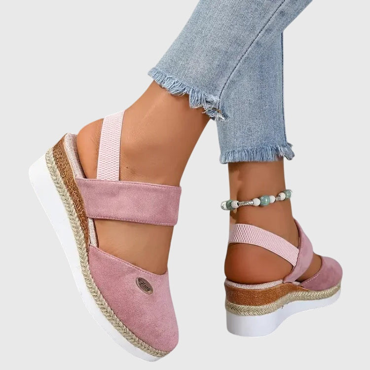 Platform sole of women's orthopedic sandals with espadrille trim and extra-wide heel for stability