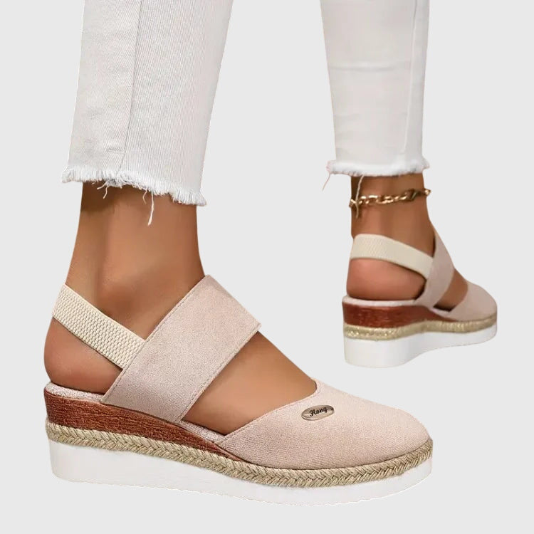 Top view of closed-toe orthopedic sandals with elastic straps and cushioned footbed for foot support