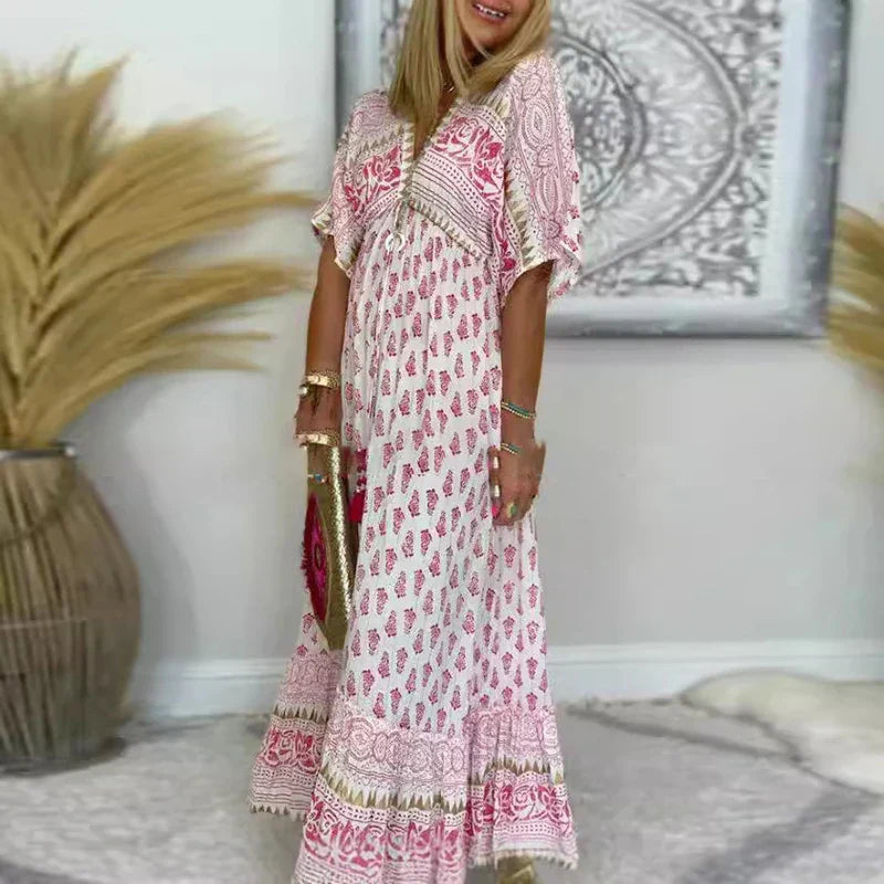 Boho print maxi dress with V-neck, short sleeves, and decorative border detailing near hem and neckline