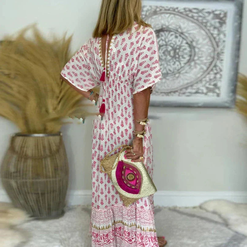 Full-length view of printed maxi dress with wide skirt and bohemian-inspired border design