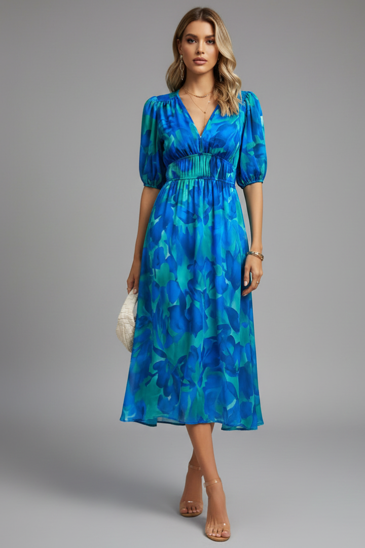 Front view of floral midi dress featuring romantic puff sleeves and flattering V-neckline with empire waist detail