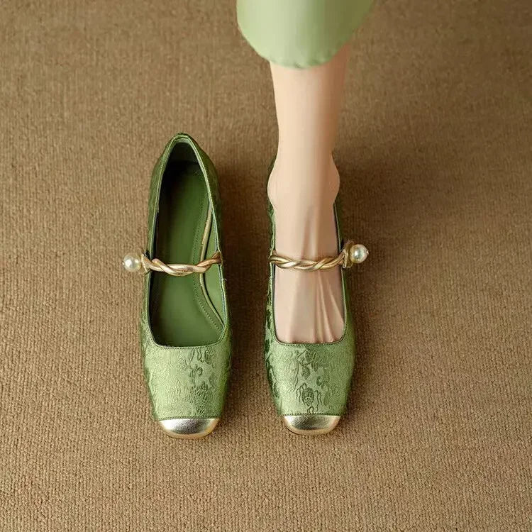 Side profile of Women's Pearl Strap Mary Jane Shoes showing square metallic toe cap and twisted strap design
