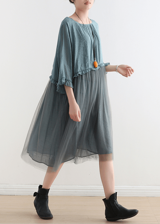 Woman wearing a flowing Tulle Maxi Chiffon Summer Dress in dusty blue with layered tulle overlay and ruffled sleeves